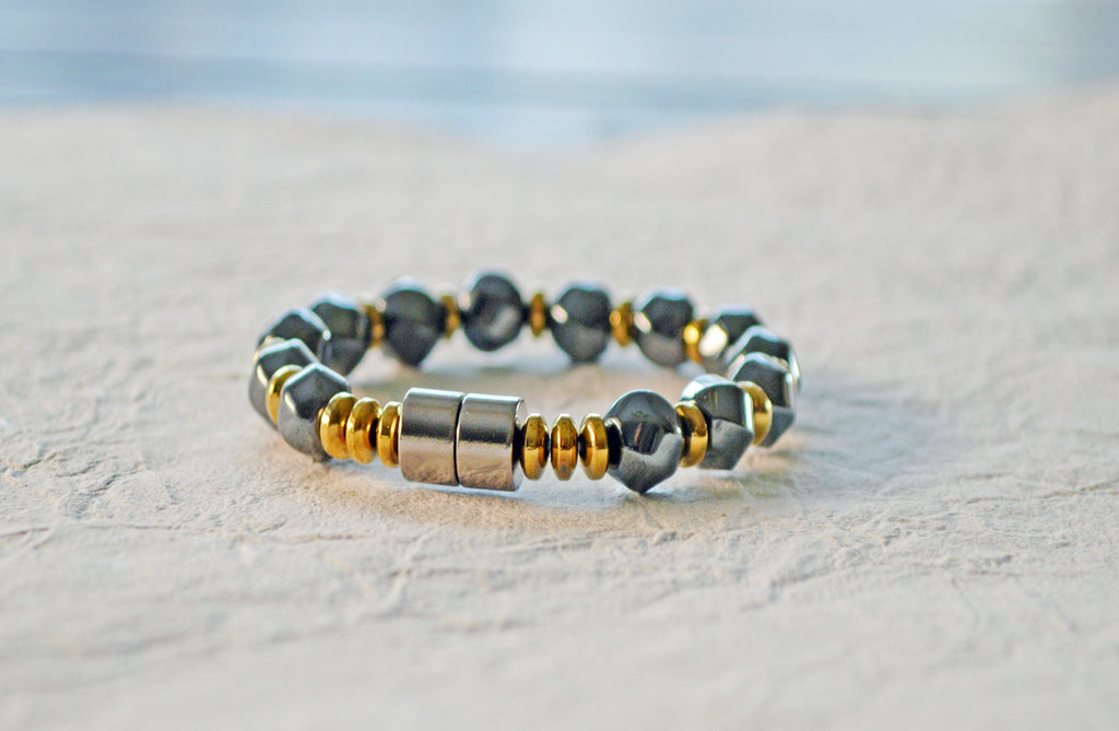 Magnetic bracelet is handcrafted with alternating black high power and gold metallic magnetic hematite beads. It is secured with a strong and easy-to-use magnetic clasp.