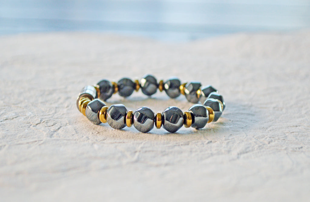 Magnetic bracelet is handcrafted with alternating black high power and gold metallic magnetic hematite beads. It is secured with a strong and easy-to-use magnetic clasp.