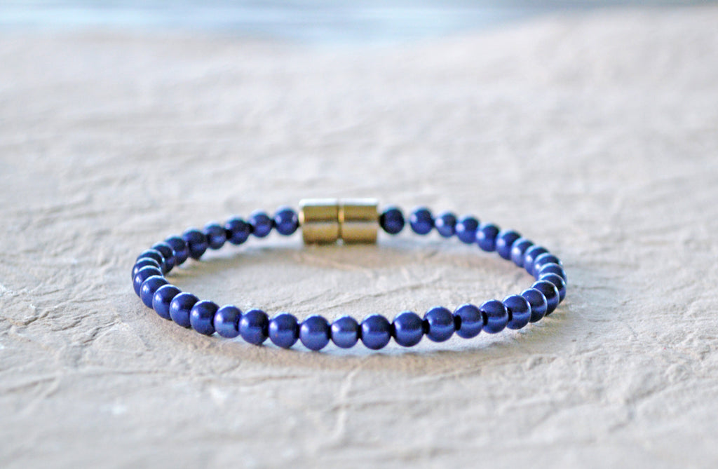 Blue magnetic bracelet handcrafted with blue pearl hematite magnetic beads and secured with a strong and easy-to-use magnetic clasp.