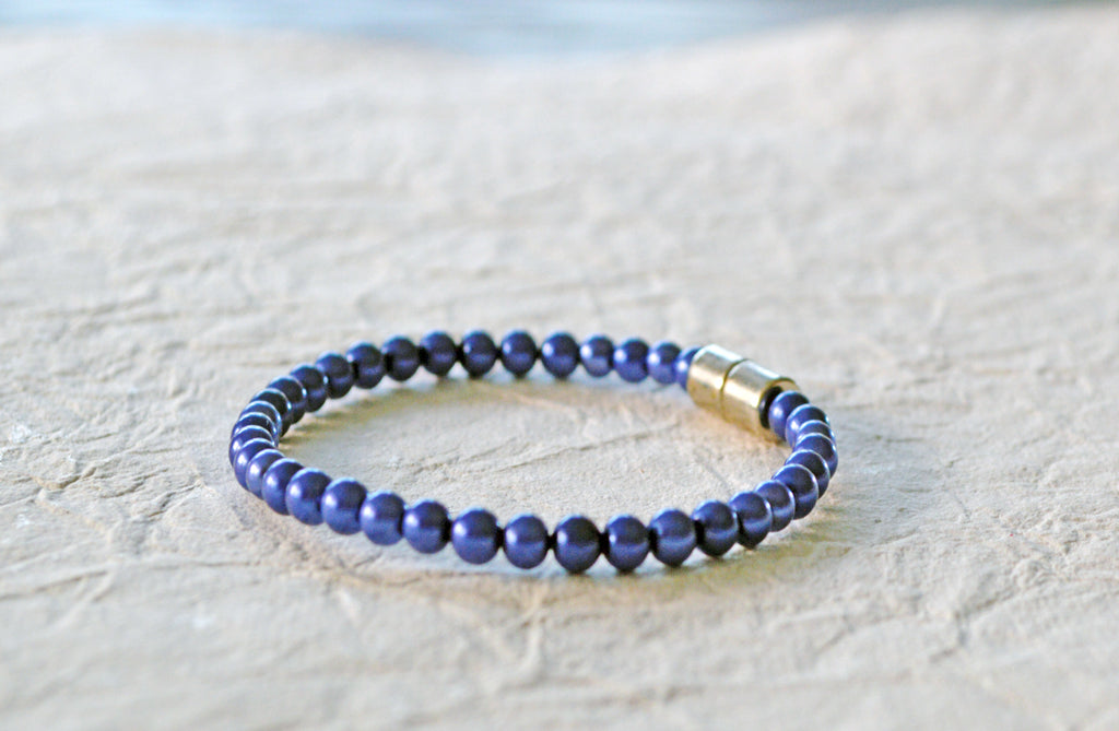 Blue magnetic bracelet handcrafted with blue pearl hematite magnetic beads and secured with a strong and easy-to-use magnetic clasp.