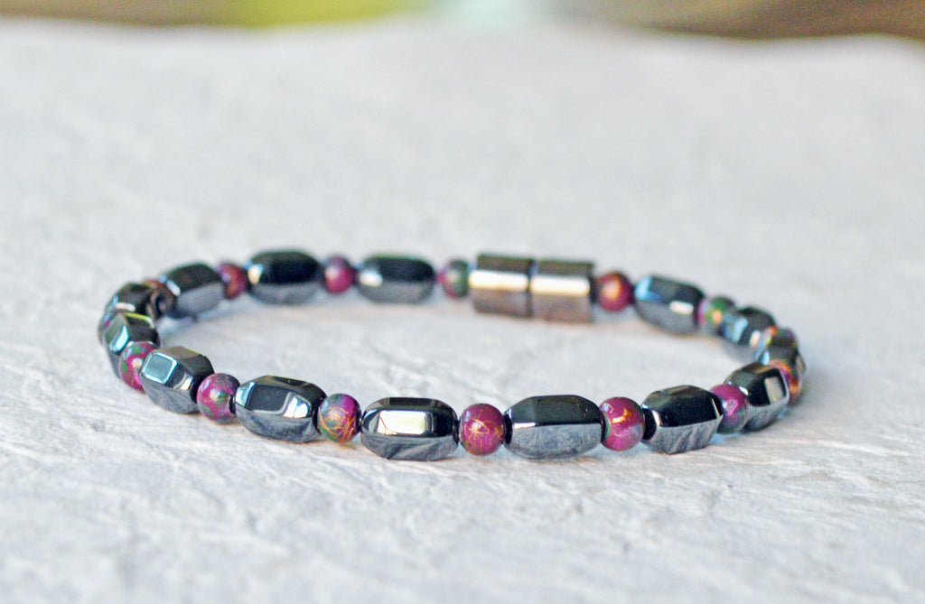 Magnetic bracelet is handcrafted with alternating black and burgundy magnetic hematite beads. It is secured with a strong and easy-to-use magnetic clasp.