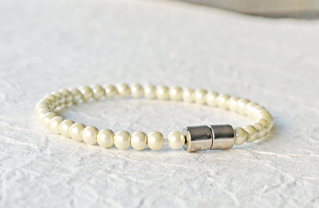 Magnetic bracelet handcrafted with cream pearl hematite magnetic beads and secured with a strong and easy-to-use magnetic clasp.
