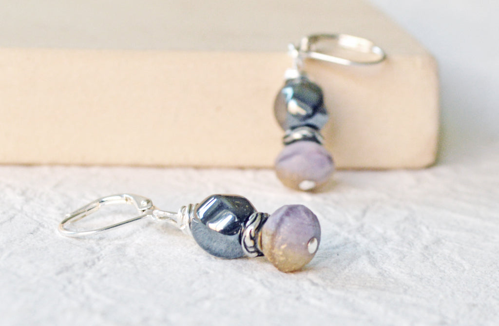 Magnetic earrings are handcrafted with black high power magnetic hematite earrings, purple/bronzed czech glass beads, and antique silver spacer beads. The beads all hang from antique silver leverbacks.