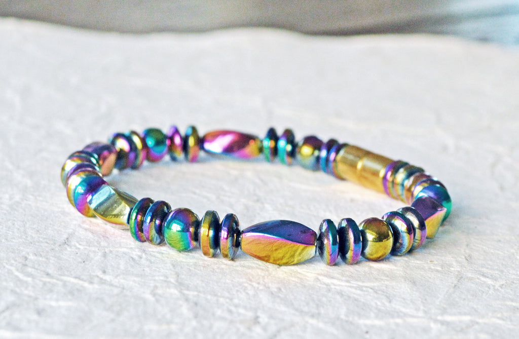 Magnetic therapy bracelet handcrafted with iridescent rainbow hematite magnetic beads. Bracelet is secured with a strong and easy-to-use magnetic clasp.