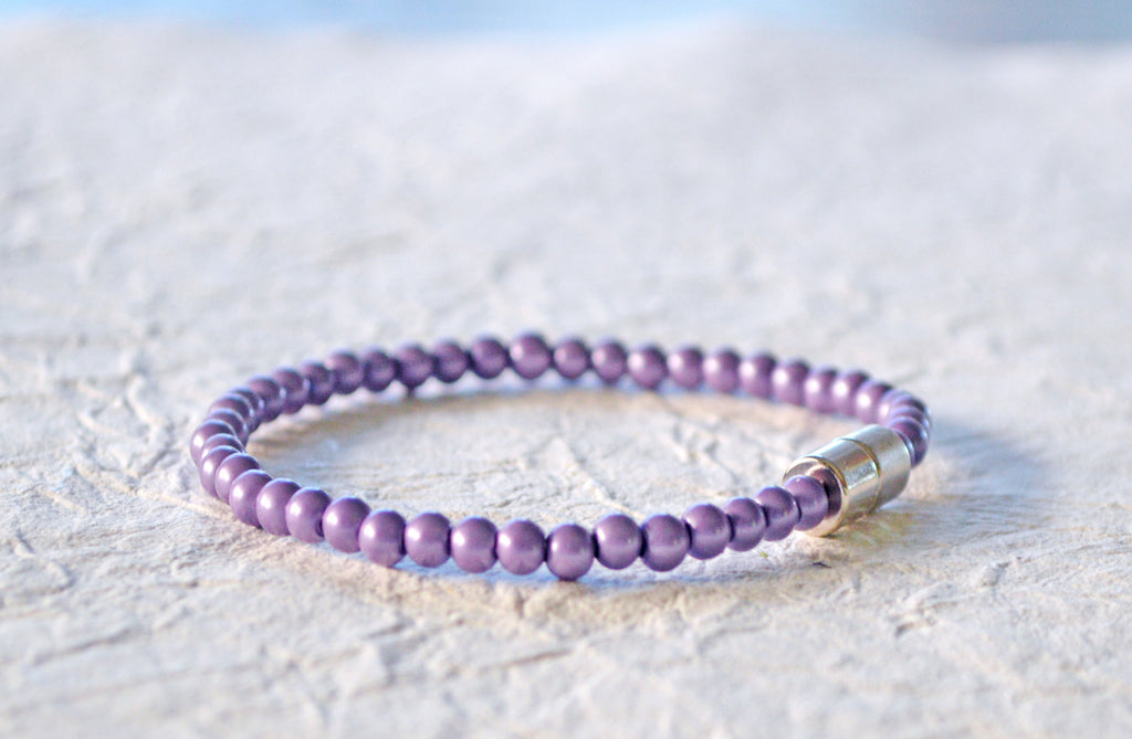 Magnetic bracelet handcrafted with lavender pearl hematite magnetic beads. It is secured with a strong and easy-to-use magnetic clasp.