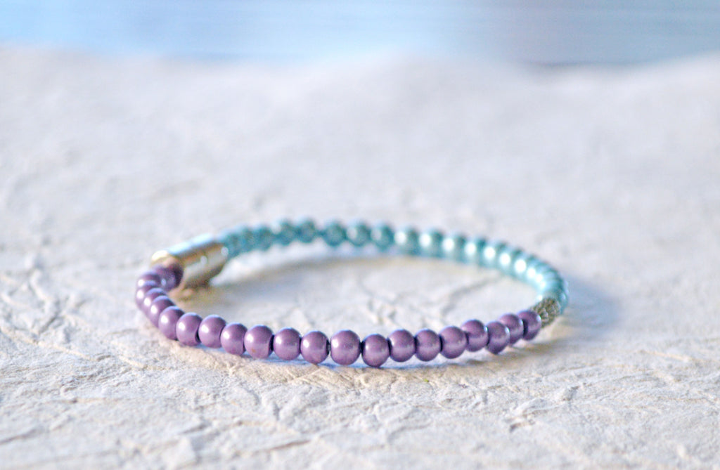 Magnetic bracelet handcrafted with lavender and light blue pearl hematite magnetic beads. It is secured with a strong and easy-to-use magnetic clasp.