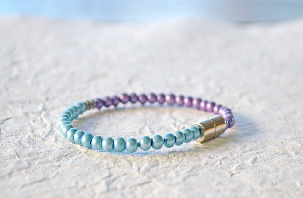 Magnetic bracelet handcrafted with lavender and light blue pearl hematite magnetic beads. It is secured with a strong and easy-to-use magnetic clasp.