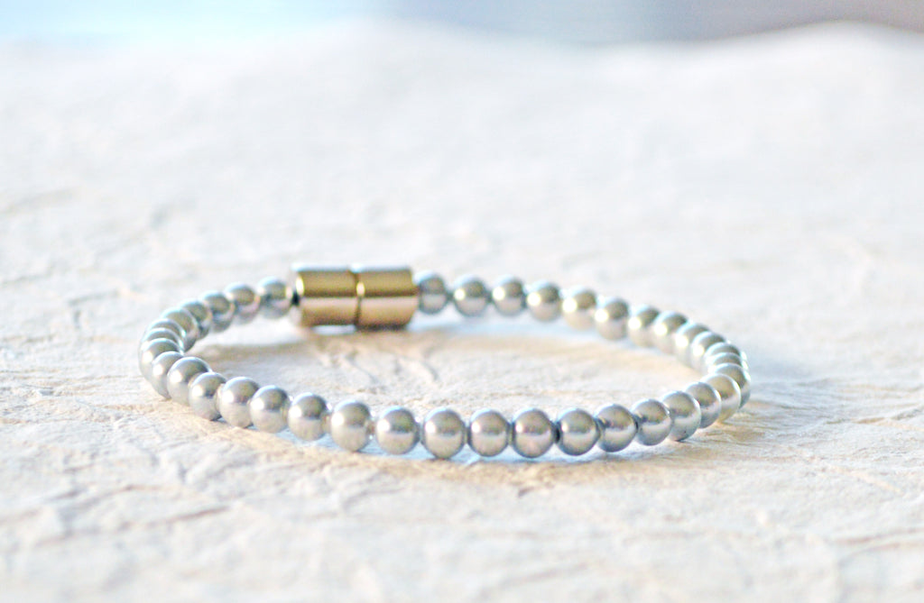 Magnetic bracelet handcrafted with silver pearl hematite magnetic beads. It is secured with a strong and easy-to-use magnetic clasp.