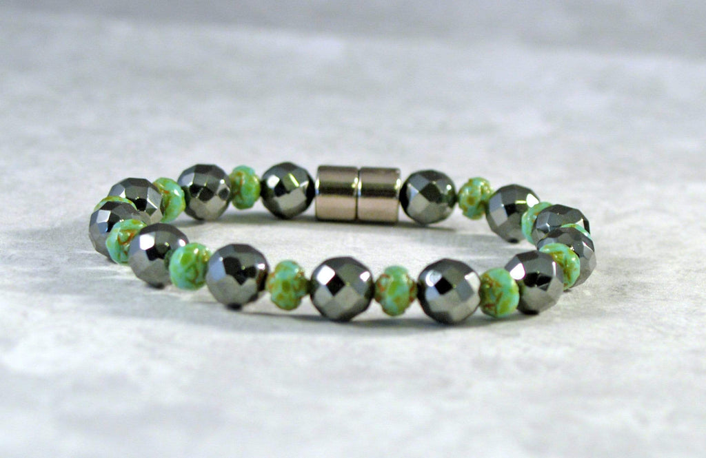 Magnetic Bracelet handcrafted with alternating black magnetic hematite and green turquoise czech glass beads. It is secured with a strong and easy-to-use magnetic clasp.
