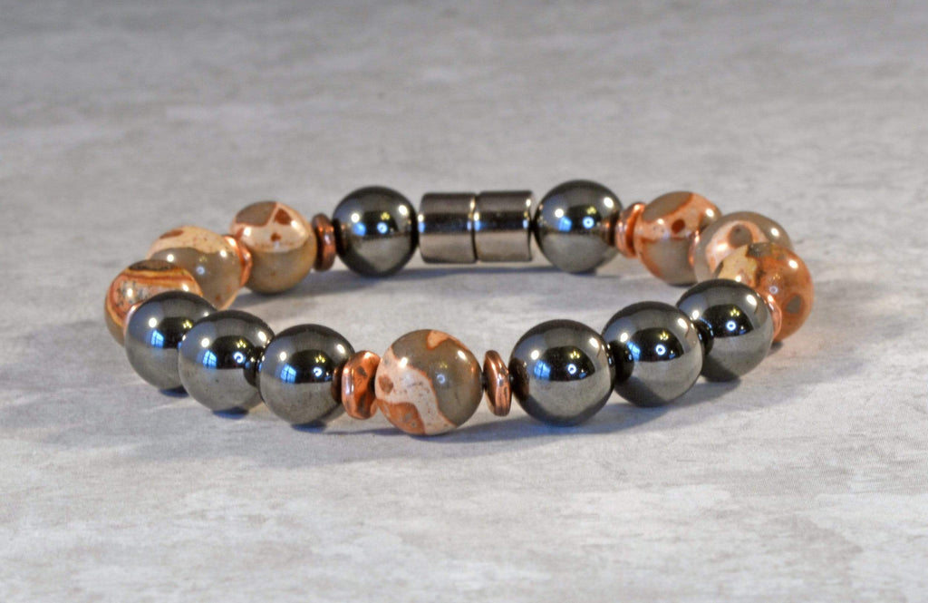 Magnetic bracelet handcrafted with black high power magnetic hematite beads, safari jasper gemstone beads, and antique copper spacer beads. It is secured with a strong and easy-to-use magnetic clasp.