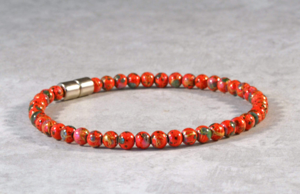 Magnetic bracelet handcrafted with red picasso hematite magnetic beads and secured with a strong and easy-to-use rare earth magnetic clasp.