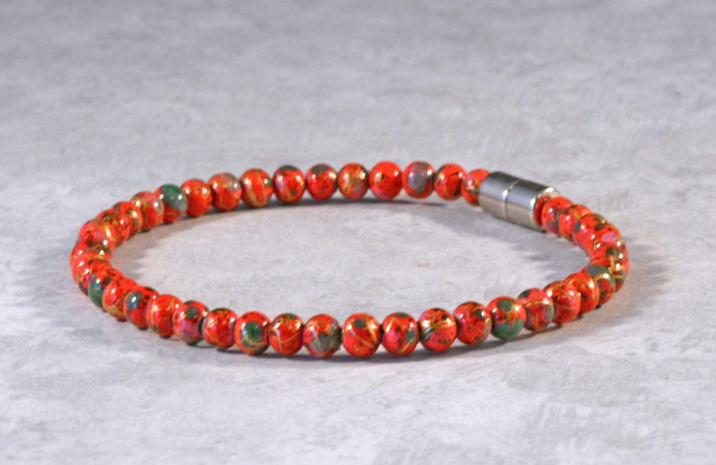 Magnetic bracelet handcrafted with red picasso hematite magnetic beads and secured with a strong and easy-to-use rare earth magnetic clasp.