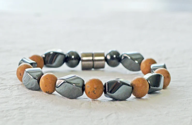 Magnetic bracelet is handcrafted with alternating black high power magnetic hematite beads and grain stone beads. It is secured with a strong and easy-to-use magnetic clasp.