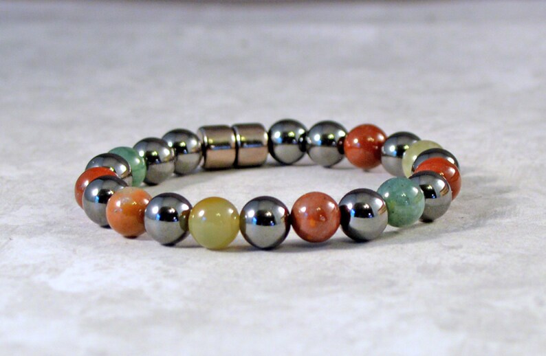 Magnetic therapy bracelet with alternating black magnetic hematite beads and fancy jasper gemstones. The bracelet is secured with a strong and easy-to-use magnetic clasp.
